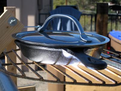 Small cast iron pan on cooking surface.