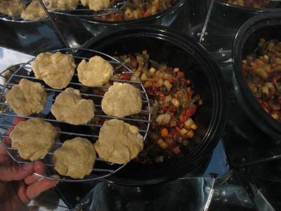 Putting the bread into Hot Pot  with the stew