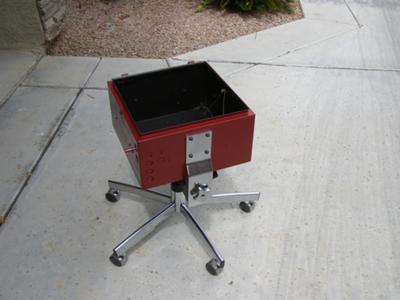 Our box cooker mounted on an old office chair